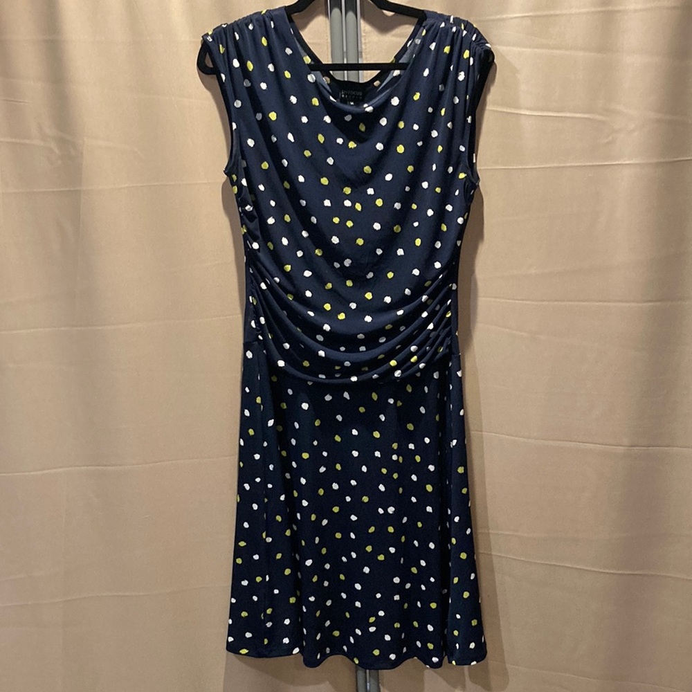 Navy blue ruched sides dress with green and white polka dots dress